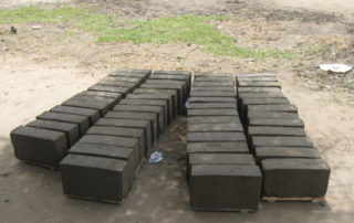 A group of blocks sitting on top of the ground.
