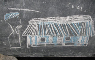 A chalk drawing of a building with a person standing on top.